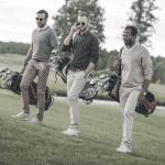 3 men dressed stylish on golf course