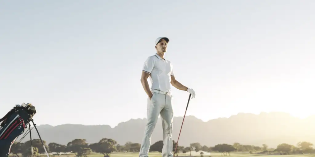 Male golfer standing on tee box
